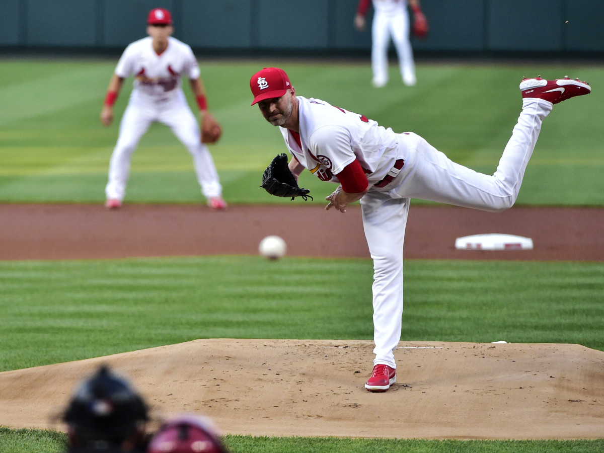 Aug 4, 2021; St. Louis, Missouri, USA;  St. Louis Cardinals starting pitcher J.A. Happ (34) pitches to Atlanta Braves right fielder Jorge Soler (12) during the first inning at Busch Stadium.